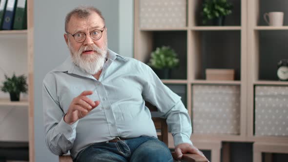 Elderly Man Blogger Recording Video Talking Online Video Call Doctor Consultation at Home