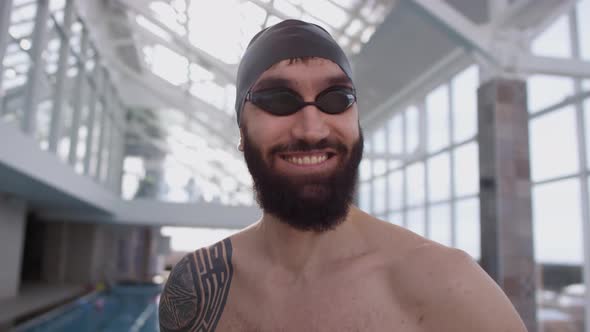 Portrait of Happy Swimmer in Indoor Pool