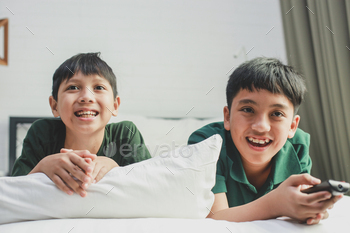 Asian Boys Watching TV Together / Photodune, Misc