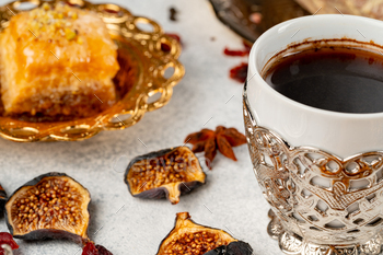 Cup of coffee and turkish pastries on dark surface / Photodune, Misc