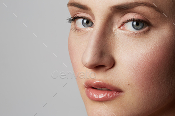 Portrait of beautifull young femle with natural makeup over white background. / Photodune, Misc