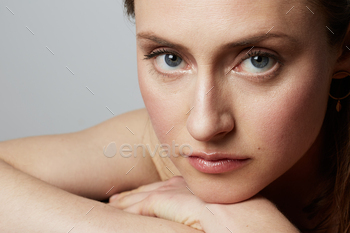 Beauty portrait of a smiling young female with natural makeup over white background. / Photodune, Misc