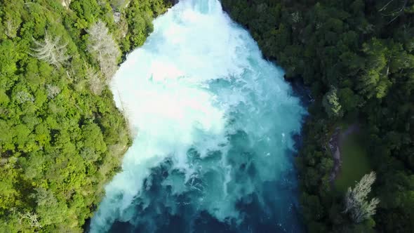 Aerial Tilt shot of blue and white rapids of river in New Zealand