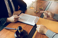 Client is submitting information on the paper of the prosecution document to the lawyer. - PhotoDune Item for Sale