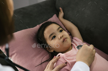 little girl a woman slept in a pillow on the sofa for a female doctor using stethoscope / Photodune, Misc
