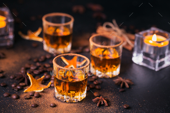 Whiskey, brandy or liquor, spices, anise stars, coffee beans, cinnamon sticks / Photodune, Misc