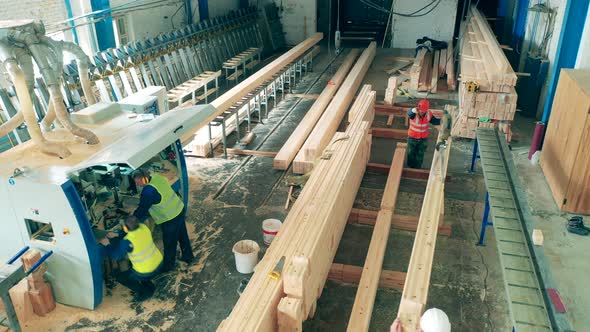 Top View of Wooden Balks Getting Relocated in Factory Premises