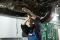Mechanic in uniform is working in auto service - PhotoDune Item for Sale