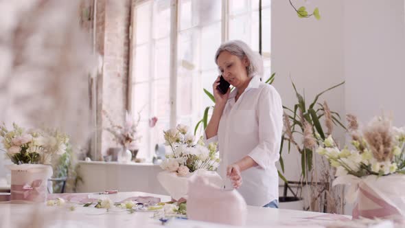 Female Florist Talking on Phone