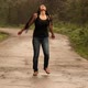 Slow Motion of a Young Caucasian Woman Enjoying the Summer Rain Raising Her Hands on a Road in the - VideoHive Item for Sale