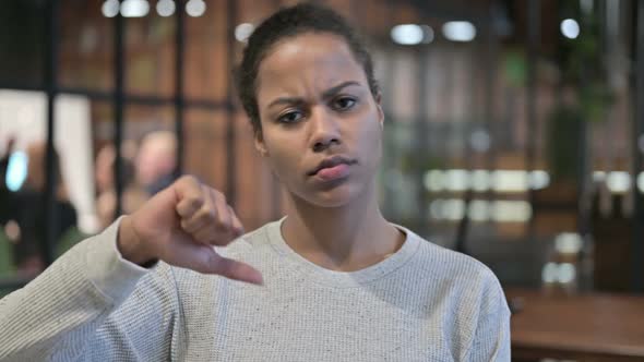 Thumbs Down By Disappointed African Woman