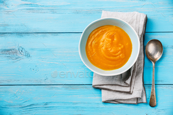 Pumpkin soup on blue wooden background Copy space / Photodune, Misc