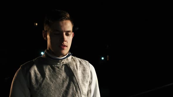 Portrait Of Young Fencer Man Looking Into Camera On The Street.