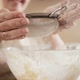 Slow Motion of Young Woman Making Dough and Sifting Flour with Metal Sieve - VideoHive Item for Sale