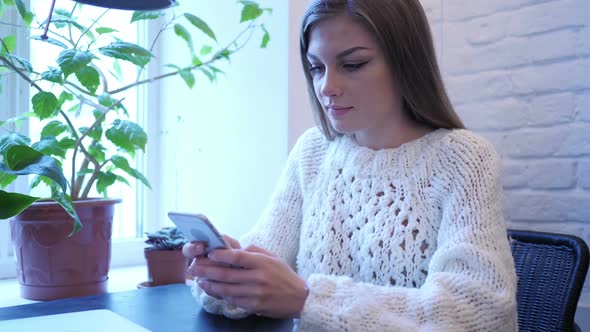 Woman Busy Using Phone for Internet Browsing