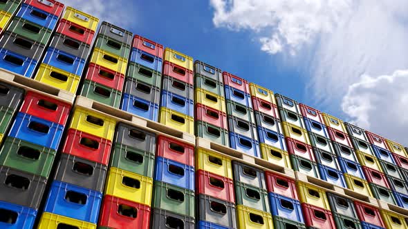 Loop of countless colorful beer crates stacked in an outdoor warehouse. 4KHD