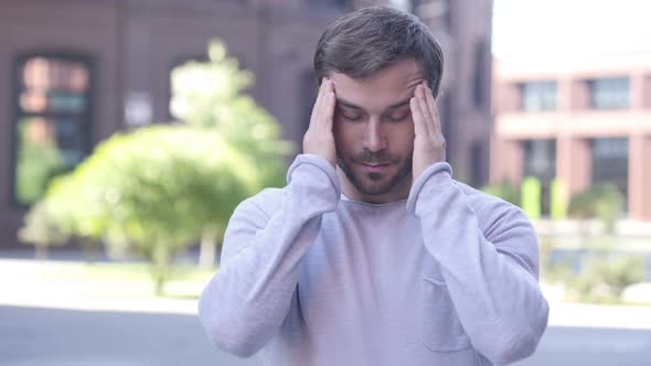 Headache Portrait of Tense Handsome Man in Office