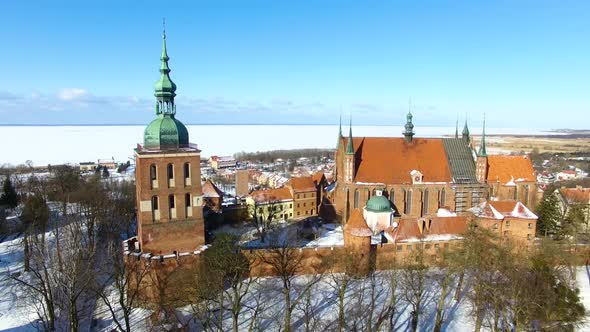 Aerial: Castle of Frombork in Poland, wintertime