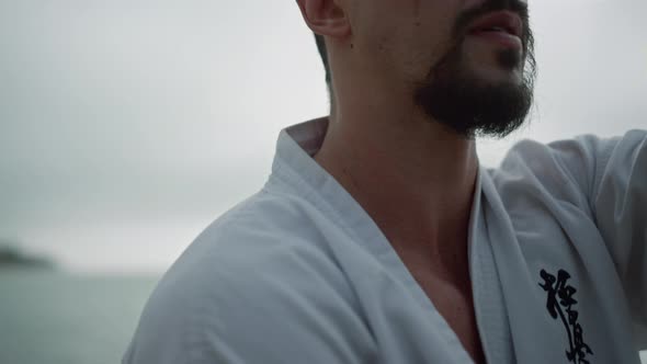 Closeup Man Training Karate Near Ocean