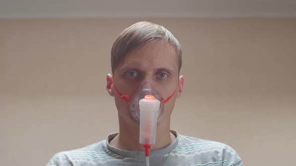 Sick Man In Oxygen Mask