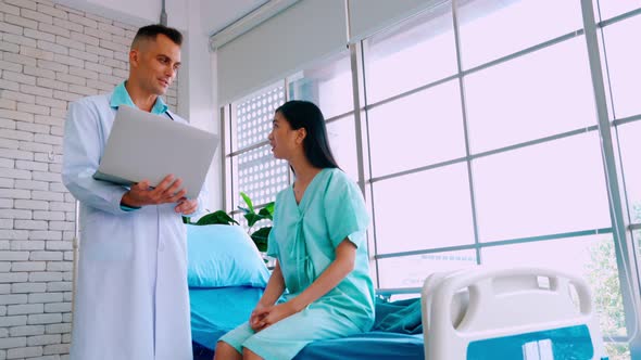 Doctor in Professional Uniform Examining Patient at Hospital