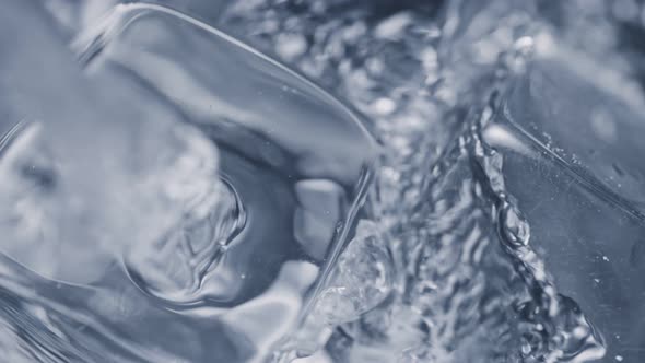 Super Slow Motion Detail Shot of Pouring Vodka on Ice Cubes at 1000 Fps