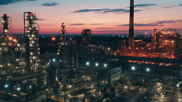 Oil Refinery Factory with Electric Lights Filmed at Sunset