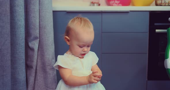 Pretty Baby Smiling in White Dress