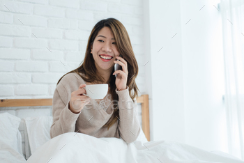Asian woman using the smartphone in the morning. / Photodune, Misc
