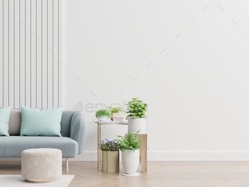 Empty living room with blue sofa, plants and table on empty white wall background. / Photodune, Misc