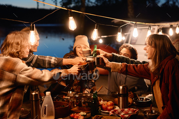 Friends at a party outdoors / Photodune, Misc