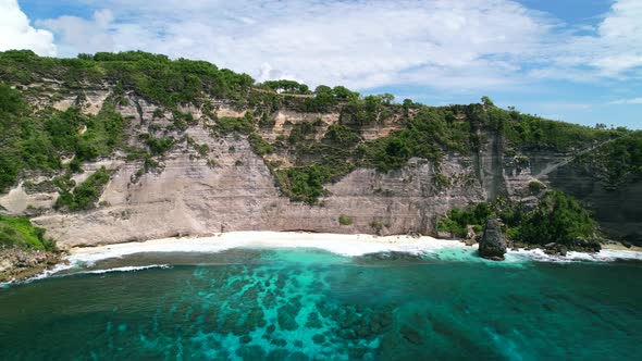 Aerial drone video of Diamond Beach in Nusa Penida Bali during the day