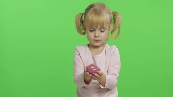 Kid Playing with Hand Made Toy Slime, Child Having Fun Making Pink Slime