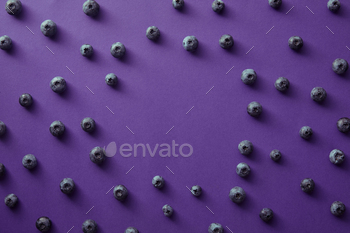 top view of circle of blueberries on violet surface / Photodune, Misc