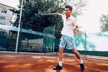 Fit man plays tennis on tennis field / Photodune, Misc