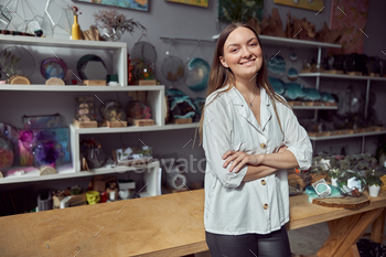 Young caucasian happy seller woman at botanic shop / Photodune, Misc