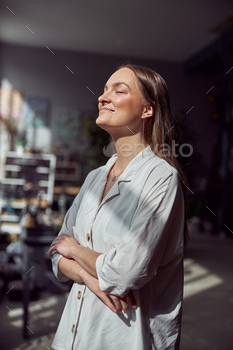 Young caucasian happy seller woman at botanic shop / Photodune, Misc
