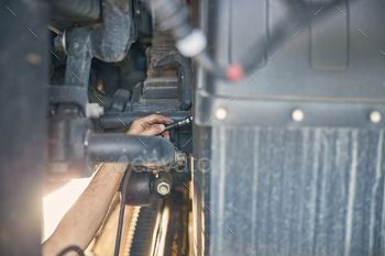 Close up of male hand connecting the pump / Photodune, Misc
