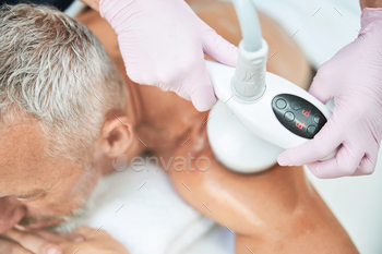aving a non-invasive ultrasound cavitation procedure done on his shoulder