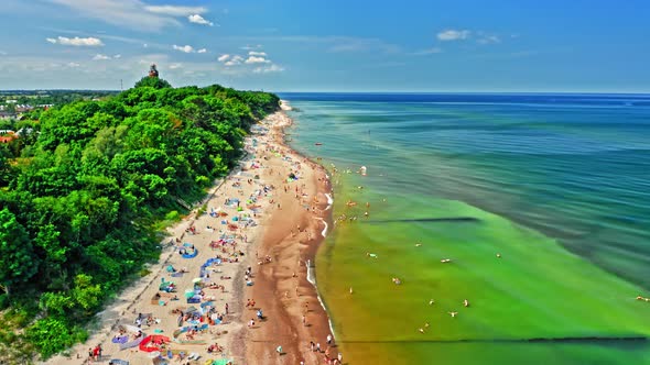 Crowded beach with people in Baltic Sea, aerial view