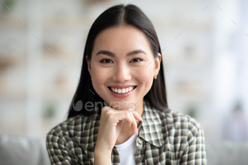 Potrait of attractive asian woman chilling at home / Photodune, Misc
