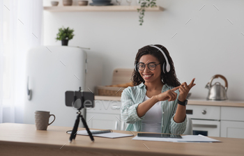 Modern tutor teaches online, devices for remote work at home / Photodune, Misc