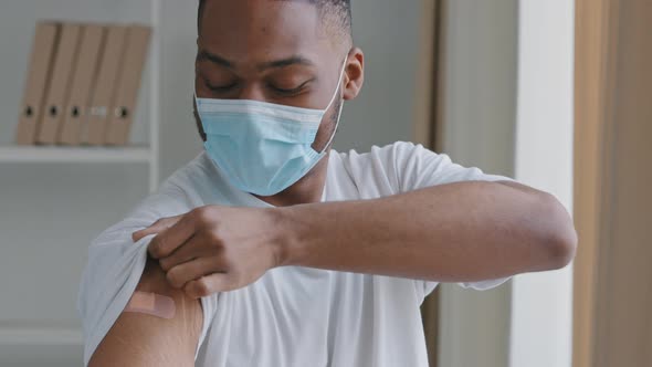 Happy Young African American Man Ethnic Black Guy Patient Wears White Tshirt and Medical Protective
