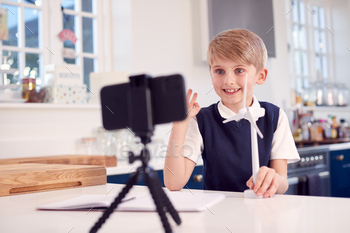 Boy At Home Wearing School Uniform With Model Of Wind Turbine Recording Video About Green Energy / Photodune, Misc