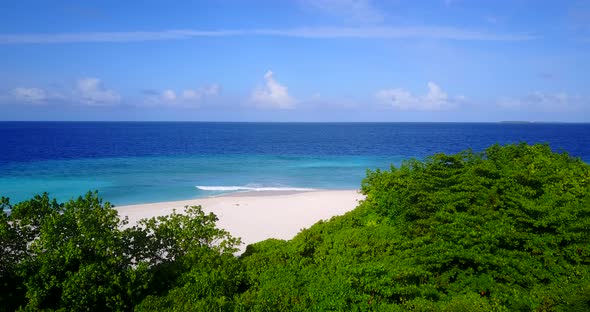 Beautiful aerial copy space shot of a white sand paradise beach and aqua blue water background