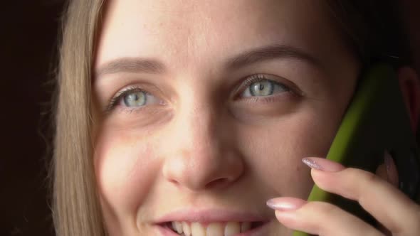 Beautiful Young Woman Talking on the Phone