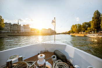 ing on Seine river during the sunset in Paris