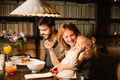 Parents with their curly daughter, having healthy meal together. Nutrition Concept. - PhotoDune Item for Sale
