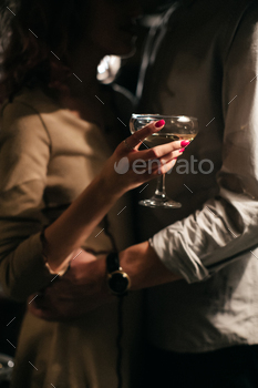 Romantic dinner. Couple cheers with white wine / Photodune, Misc