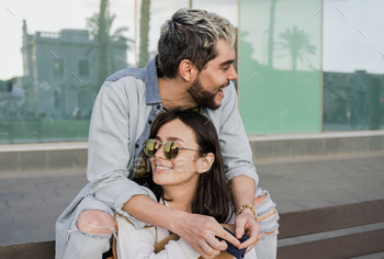 Young couple of lovers having fun outdoors at the city during vacation time - Focus on girl face / Photodune, Misc